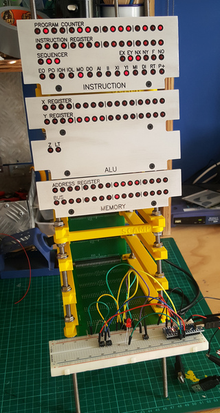 I have reached a good milestone on the SCAMP hardware: it can now execute code! It runs all the way through the test program correctly. The card cage 